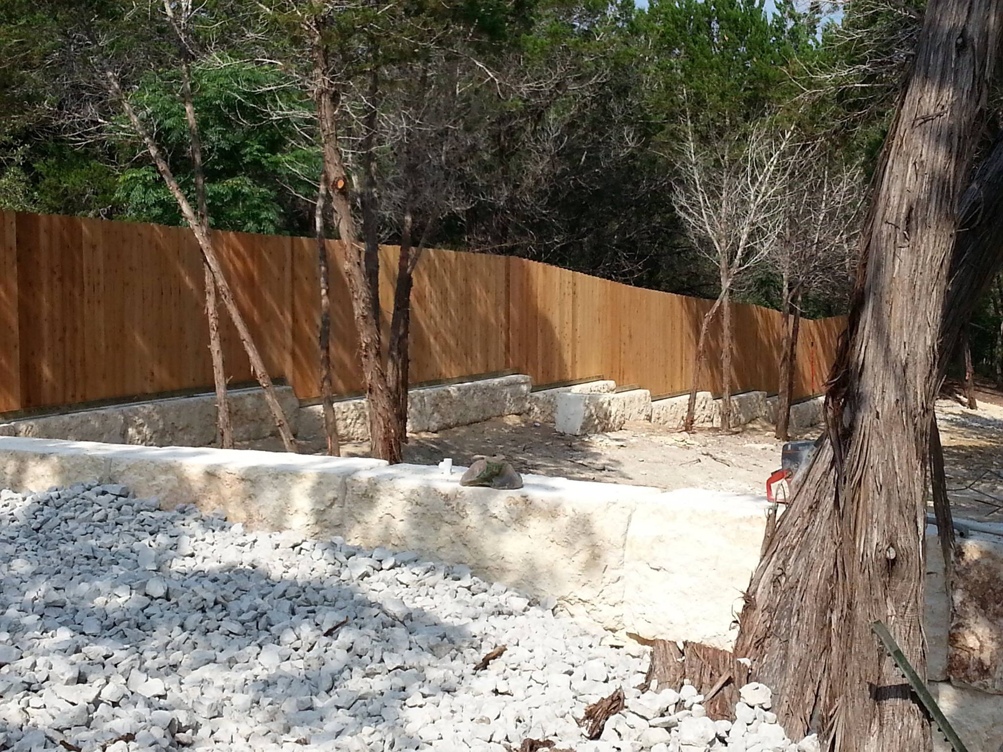 Cedar Fence on Stone Retaining Wall